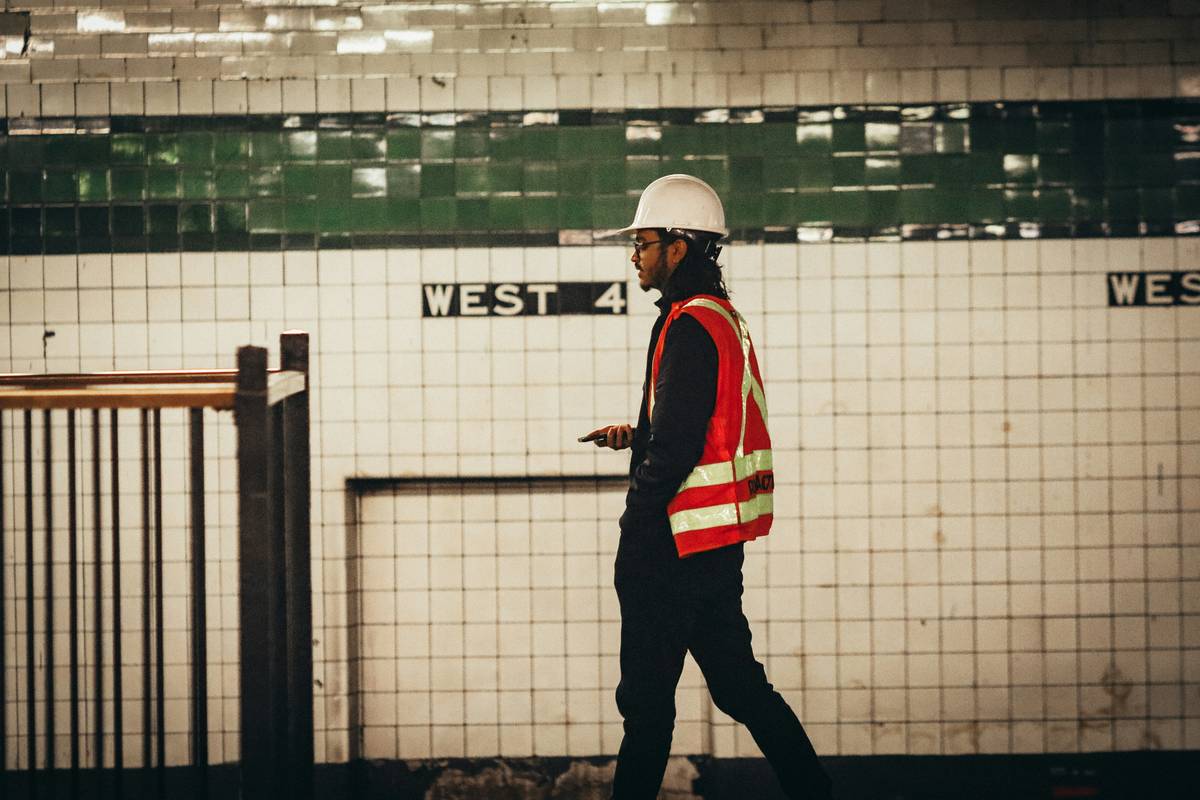 gig safety net worker delivery driver reviewing insurance options on smartphone