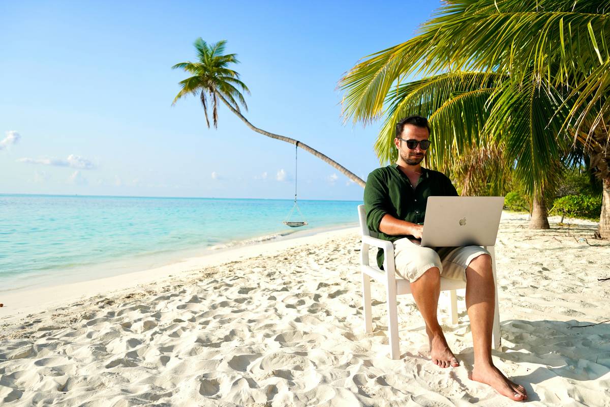 Side gigs that can provide benefits: collage of laptop (Fiverr), passport stamp (travel blogging), and freelance contract document (remote consulting)